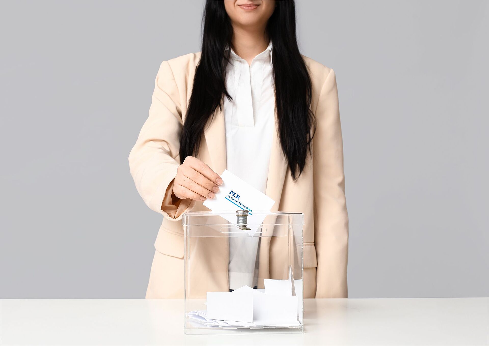 Voting woman near ballot box on grey background